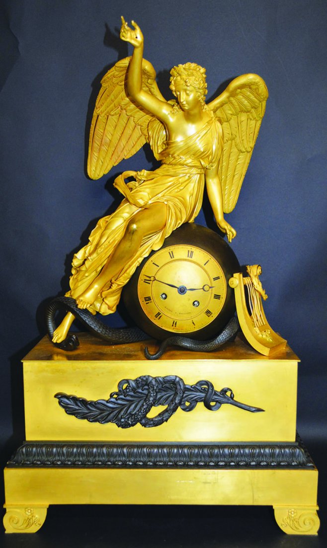 A GOOD FRENCH EMPIRE BRONZE AND ORMOLU CLOCK by ENCELY: A GOOD FRENCH EMPIRE BRONZE AND ORMOLU CLOCK by ENCELY A. TOULOUSE, with eight day movement in a ball, the case with a classical young lady, foot on a serpent. 24ins high. £3000-4000.