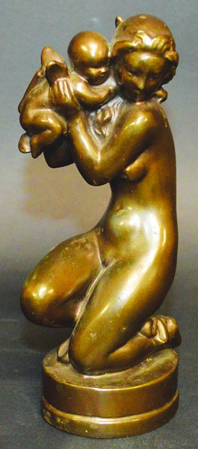L. P. A BRONZE OF A NUDE KNEELING YOUNG WOMAN holding a: L. P. A BRONZE OF A NUDE KNEELING YOUNG WOMAN holding a cupid in her arms. Monogrammed L. P. 7ins high. £60-90.