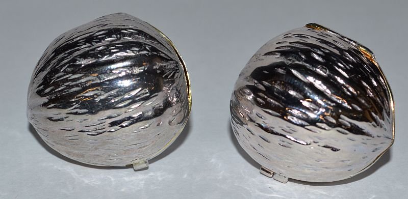 A PAIR OF STERLING SILVER WALNUT SHAPED PILL BOXES.: A PAIR OF STERLING SILVER WALNUT SHAPED PILL BOXES. £50-60.