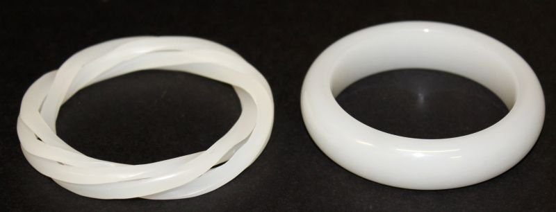 A CHINESE WHITE JADE-LIKE THREE-STRAND BANGLE, 3.25in: A CHINESE WHITE JADE-LIKE THREE-STRAND BANGLE, 3.25in diameter, the inner rim approx. 2.25in diameter; together with a white jade-like bangle, 3.1in diameter, the inner rim 2.25in diameter. (2)