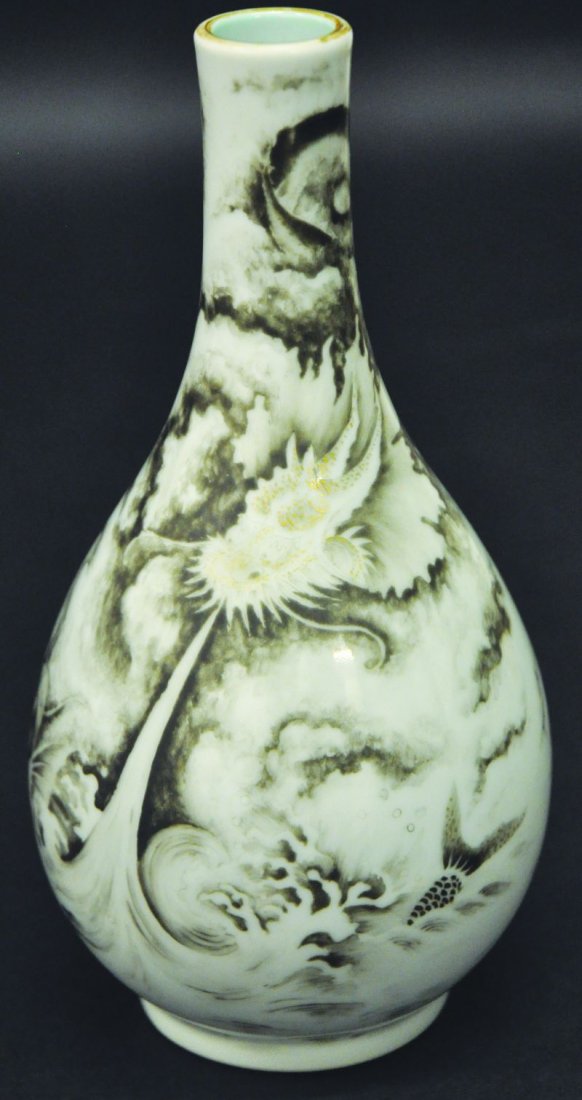 AN UNUSUAL CHINESE PORCELAIN VASE, decorated in black: AN UNUSUAL CHINESE PORCELAIN VASE, decorated in black enamelling with a scene of a cloud enveloped dragon above a carp leaping from waves, the turquoise base with a Qianlong seal mark, 8in high.