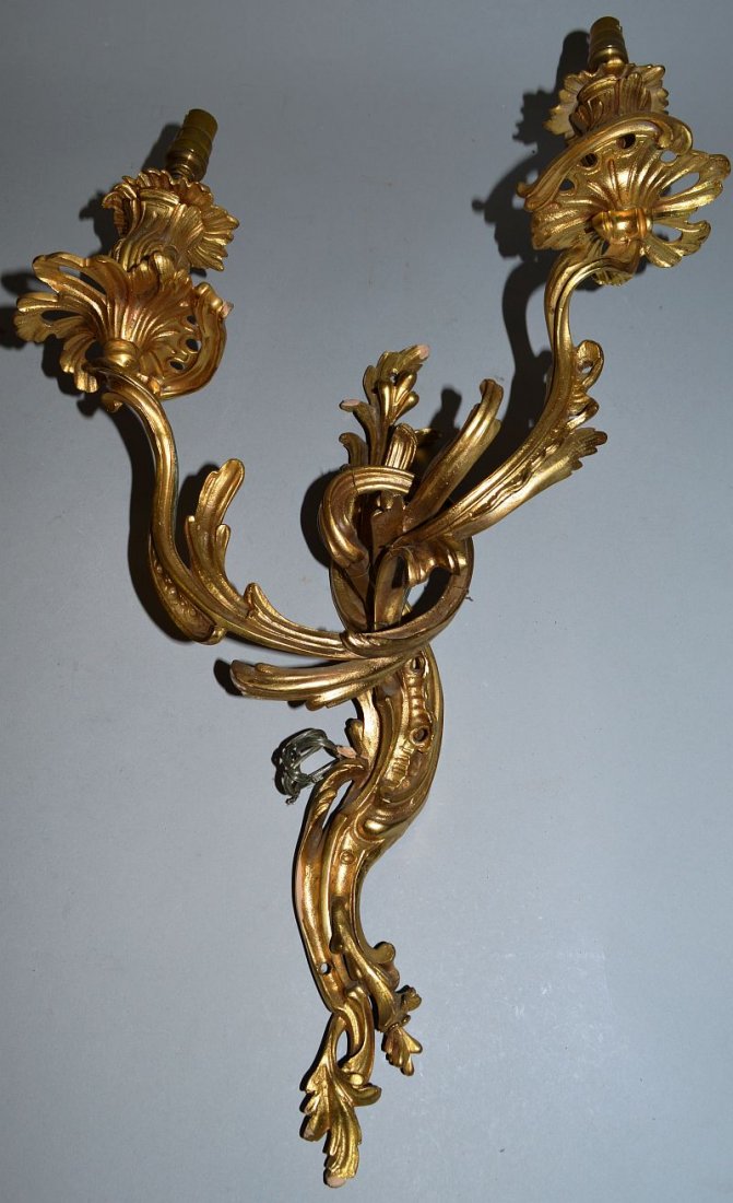 A PAIR OF LOUIS XVI DESIGN ORMOLU TWO LIGHT WALL: A PAIR OF LOUIS XVI DESIGN ORMOLU TWO LIGHT WALL SCONCES. 23ins long.