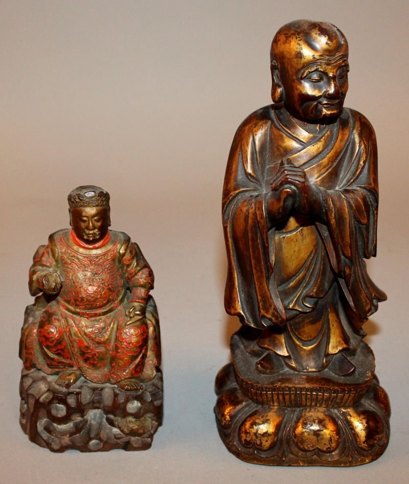 A GOOD QUALITY CHINESE LACQUERED & CARVED WOOD MODEL OF: A GOOD QUALITY CHINESE LACQUERED & CARVED WOOD MODEL OF A PRIEST, possibly 18th/19th Century, standing with hands clasped on a lotus plinth, 8.5in high; together with a smaller carved and lacquered wo