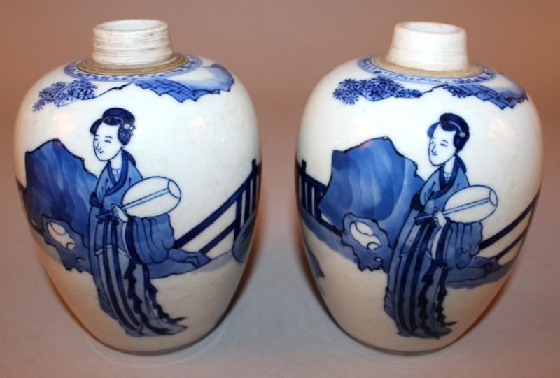 A PAIR OF CHINESE BLUE & WHITE PORCELAIN JARS, each: A PAIR OF CHINESE BLUE & WHITE PORCELAIN JARS, each decorated in vivid underglaze-blue with a continuous scene of ladies in a fenced garden setting, each base with an artemisia leaf mark, 5.6in high. 