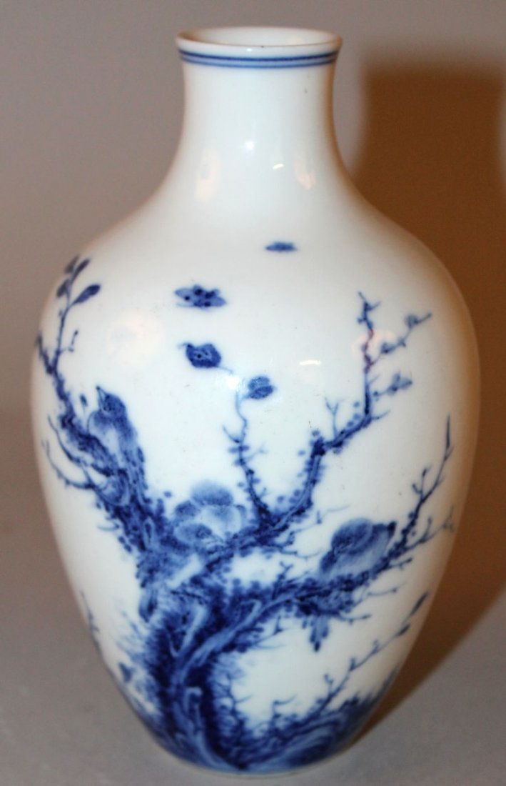 A CHINESE BLUE & WHITE PORCELAIN VASE, the sides: A CHINESE BLUE & WHITE PORCELAIN VASE, the sides decorated with a group of birds perched in a tree, the base with a six-character Chenghua mark, 6.3in high. £150-250