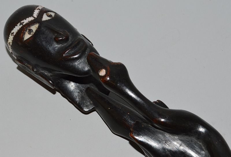 A NOIRE EBONY CANE inlaid with mother of pearl. 39ins: A NOIRE EBONY CANE inlaid with mother of pearl. 39ins long. £150-200.