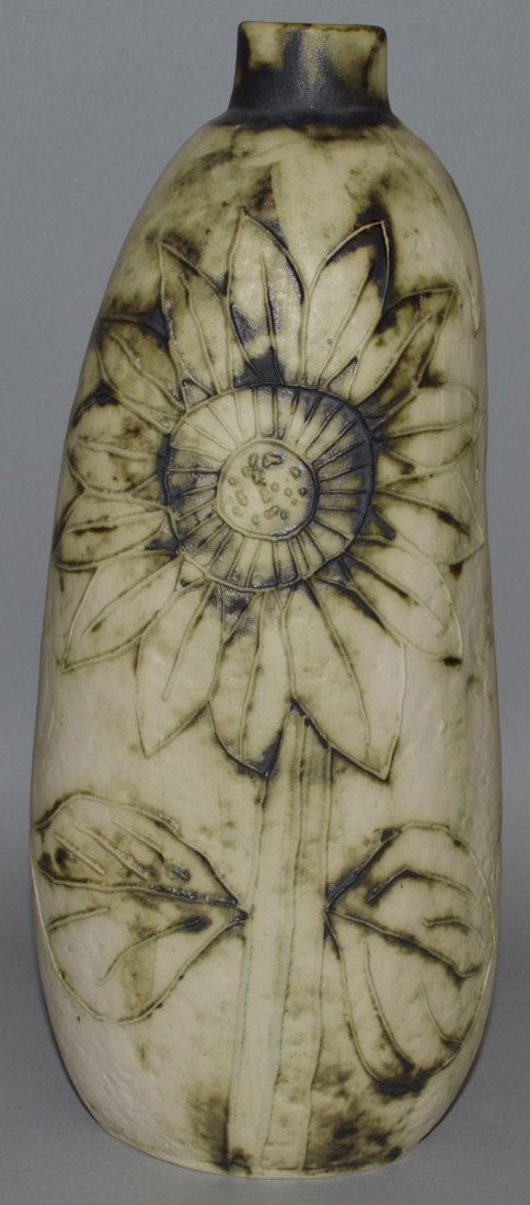 A CARN POTTERY PENZANCE CORNWALL VASE by JOHN BEUSMANS: A CARN POTTERY PENZANCE CORNWALL VASE by JOHN BEUSMANS decorated with sunflowers. Signed. 11ins high.