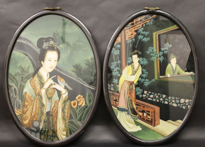 A PAIR OF CHINESE OVAL REVERSE GLASS PAINTINGS, in wood: A PAIR OF CHINESE OVAL REVERSE GLASS PAINTINGS, in wood frames, 26.75in x 19.25in.