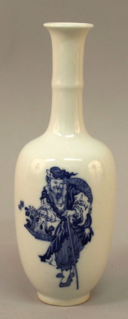 A SMALL GOOD QUALITY CHINESE BLUE & WHITE PORCELAIN: A SMALL GOOD QUALITY CHINESE BLUE & WHITE PORCELAIN VASE, decorated with an Immortal carrying a basket of flowers, the base with a Qianlong seal mark, 6.75in high.