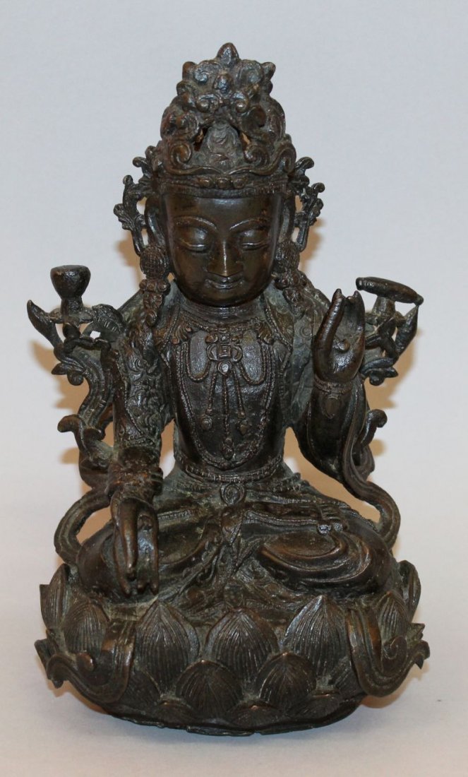 A GOOD 16TH/17TH CENTURY CHINESE MING DYNASTY BRONZE: A GOOD 16TH/17TH CENTURY CHINESE MING DYNASTY BRONZE FIGURE OF A BODHISATTVA, the deity seated in dhyanasana on a lotus plinth, his hands in mudra abhaya and varada, his neck with dependant jewelry, h