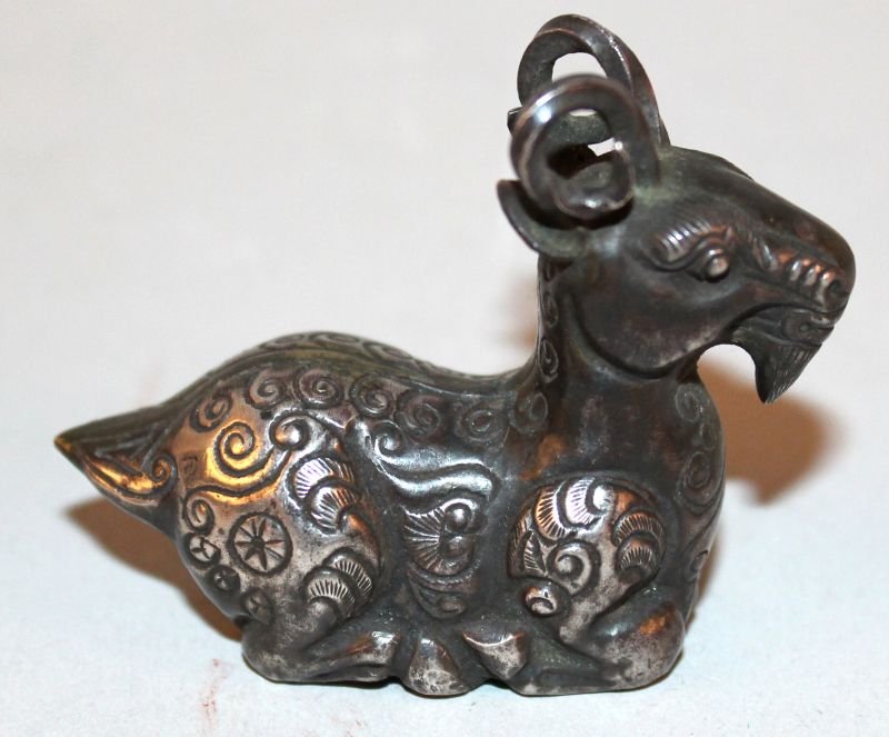 A SMALL GOOD QUALITY CHINESE SILVER-METAL MODEL OF A (1 of 3)