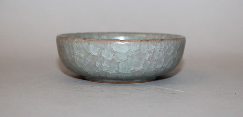 A CHINESE CELADON PORCELAIN BOWL, applied with a (1 of 4)