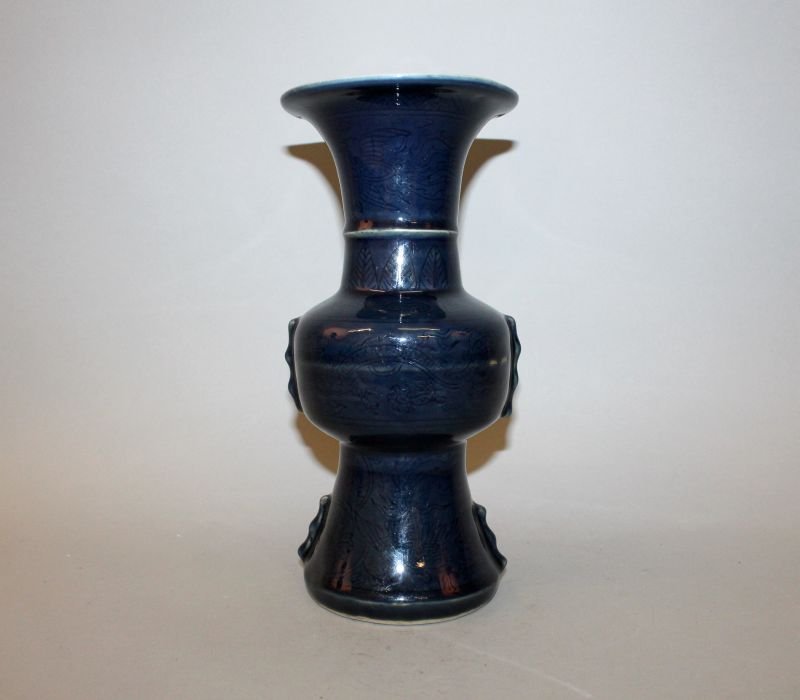 A CHINESE BLUE GLAZED PORCELAIN VASE, of near Gu form, (1 of 4)