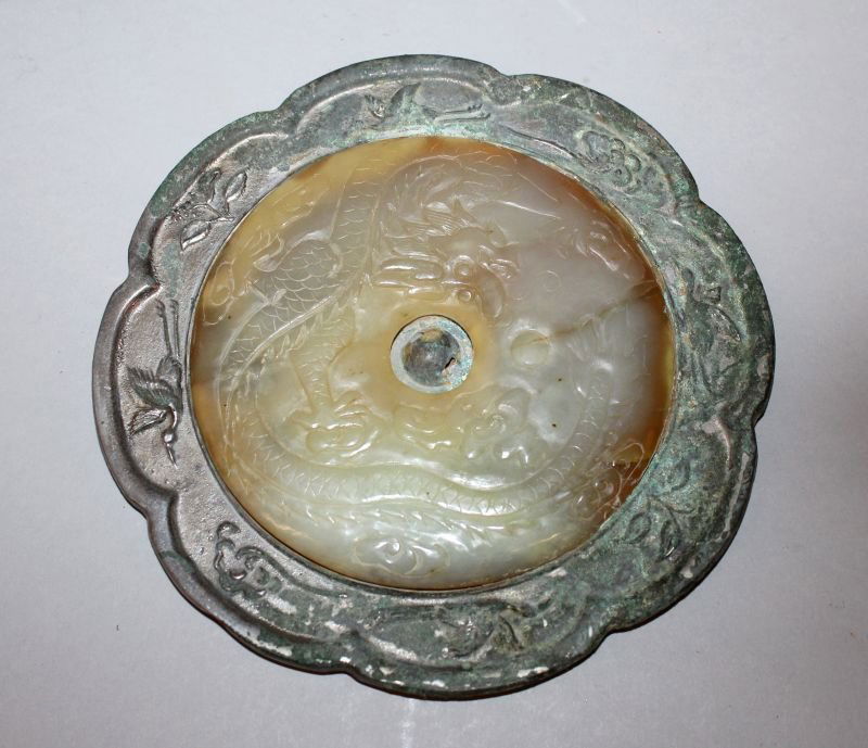 A CHINESE TANG STYLE SILVERED BRONZE MIRROR WITH A (1 of 2)
