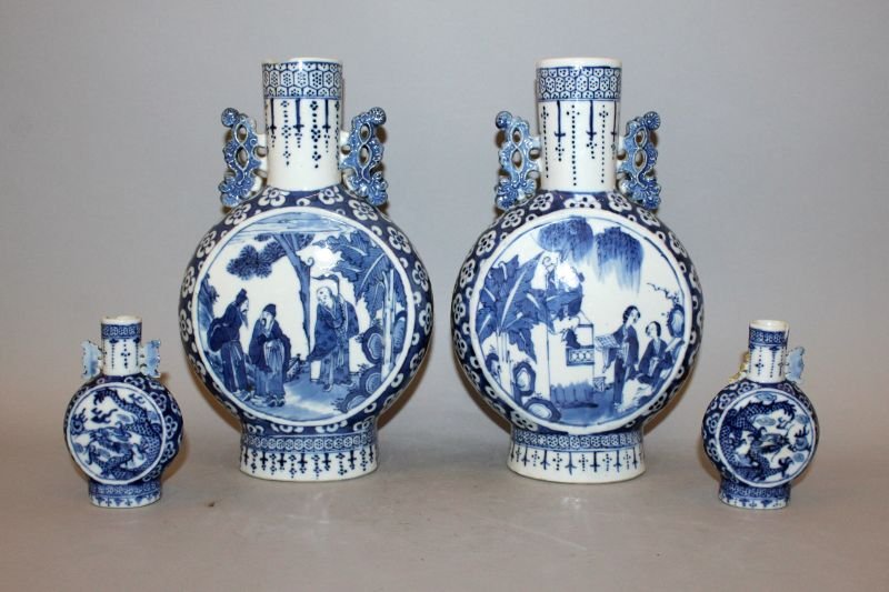 A PAIR OF 19TH CENTURY CHINESE BLUE & WHITE PORCELAIN: A PAIR OF 19TH CENTURY CHINESE BLUE & WHITE PORCELAIN MOON FLASKS, one flask painted with panels of a scene from a tale, the other with scenes of sages, 10.1in high; together with a smaller pair of Ch