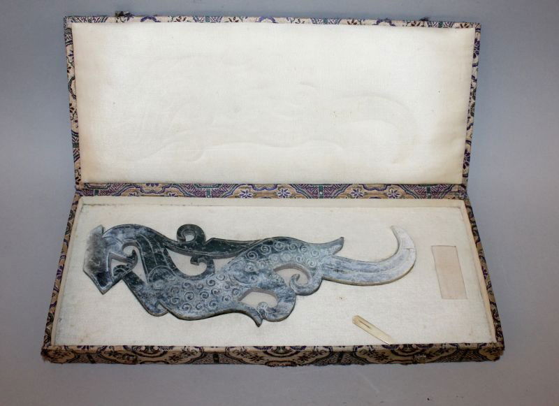 A 20TH CENTURY CHINESE ARCHAIC JADE-LIKE CARVING OF A (1 of 3)