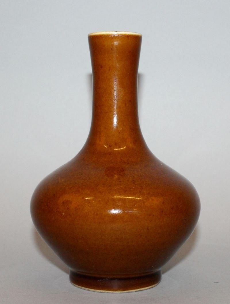A CHINESE PORCELAIN BOTTLE VASE, applied with a (1 of 3)