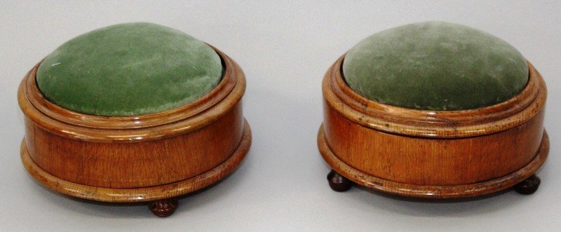 A PAIR OF UNUSUAL VICTORIAN MAHOGANY CIRCULAR SPITTOONS: A PAIR OF UNUSUAL VICTORIAN MAHOGANY CIRCULAR SPITTOONS with padded velvet rising tops and paisley interior. Tops: 1ft diameter.