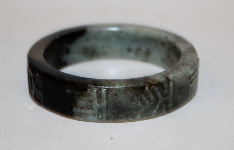 ANOTHER UNUSUAL CHINESE JADE BANGLE, 19th Century or (1 of 3)
