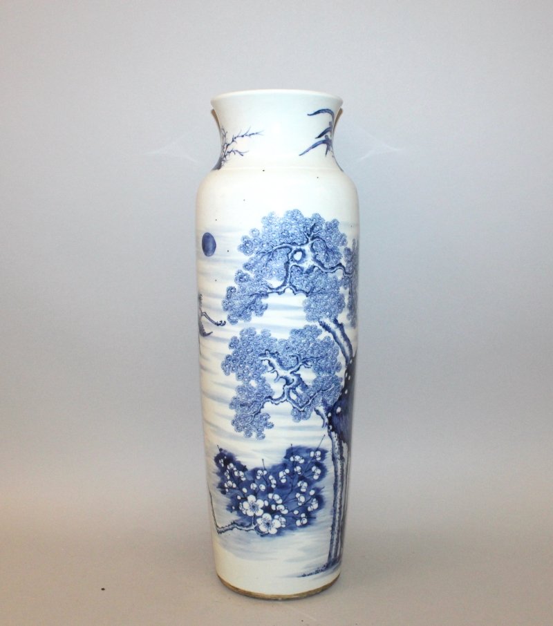 A LARGE CHINESE BLUE & WHITE PORCELAIN SLEEVE VASE, the: A LARGE CHINESE BLUE & WHITE PORCELAIN SLEEVE VASE, the sides decorated with a continuous landscape scene, the base unglazed, 18.5in high. £400-600.