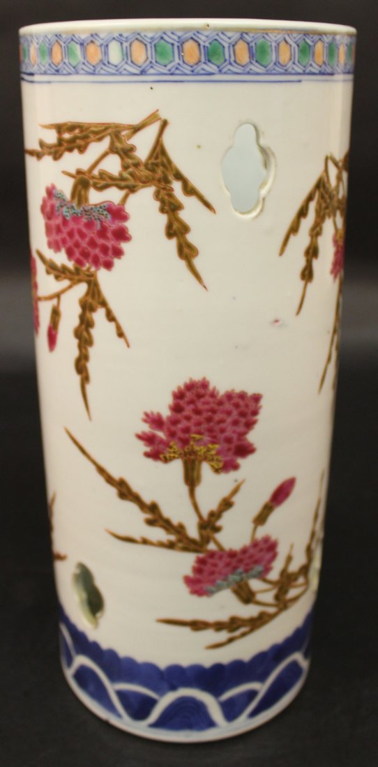 A GOOD QUALITY CHINESE FAMILLE ROSE PORCELAIN HAT VASE,: A GOOD QUALITY CHINESE FAMILLE ROSE PORCELAIN HAT VASE, circa 1900, with pierced quatrefoil apertures, painted in vivid enamels with floral sprays, the base with a Qianlong seal mark, 11.3in high. £5