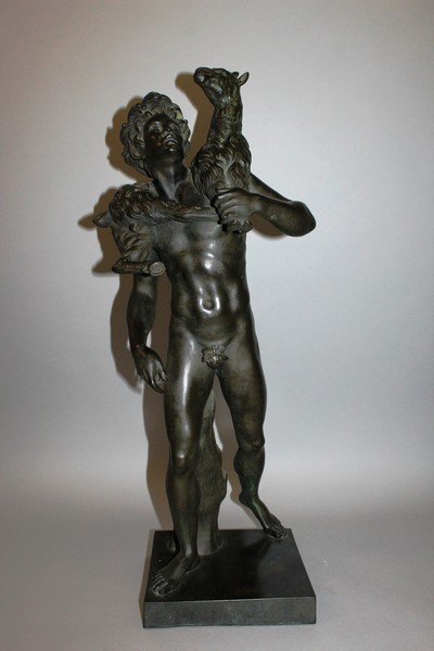 AFTER THE ANTIQUE – GIAN DA BOLOGNA A FINE BRONZE OF A: AFTER THE ANTIQUE – GIAN DA BOLOGNA A FINE BRONZE OF A BOY, A COAT OVER HIS SHOULDER, standing on a square base. 27ins high.