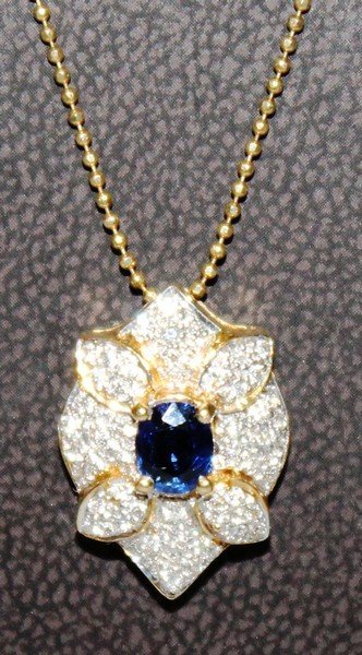 A NICE SAPPHIRE AND DIAMOND PENDANT on a fine gold: A NICE SAPPHIRE AND DIAMOND PENDANT on a fine gold chain.