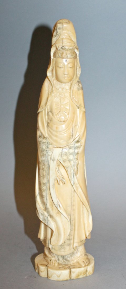 A JAPANESE CARVED IVORY FIGURE OF KWANNON, circa 1900, (1 of 4)