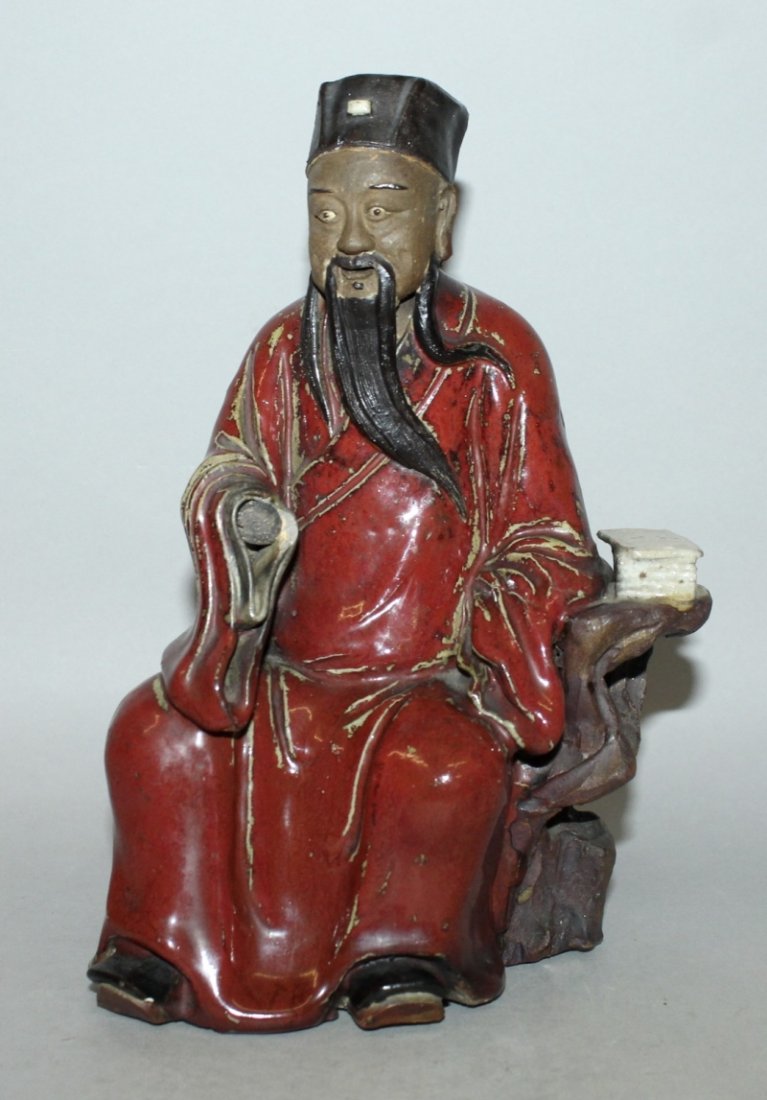 AN EARLY 20TH CENTURY CHINESE GLAZED POTTERY FIGURE OF (1 of 3)