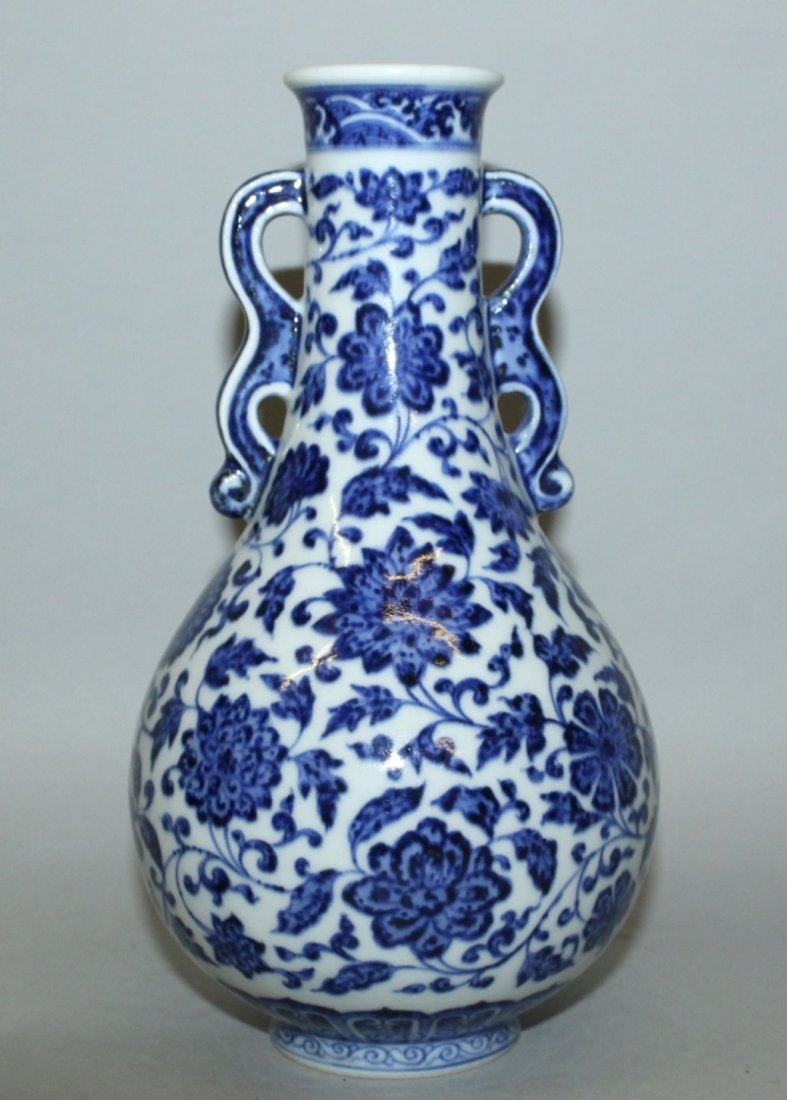 A CHINESE BLUE & WHITE MING STYLE PORCELAIN VASE, the (1 of 3)