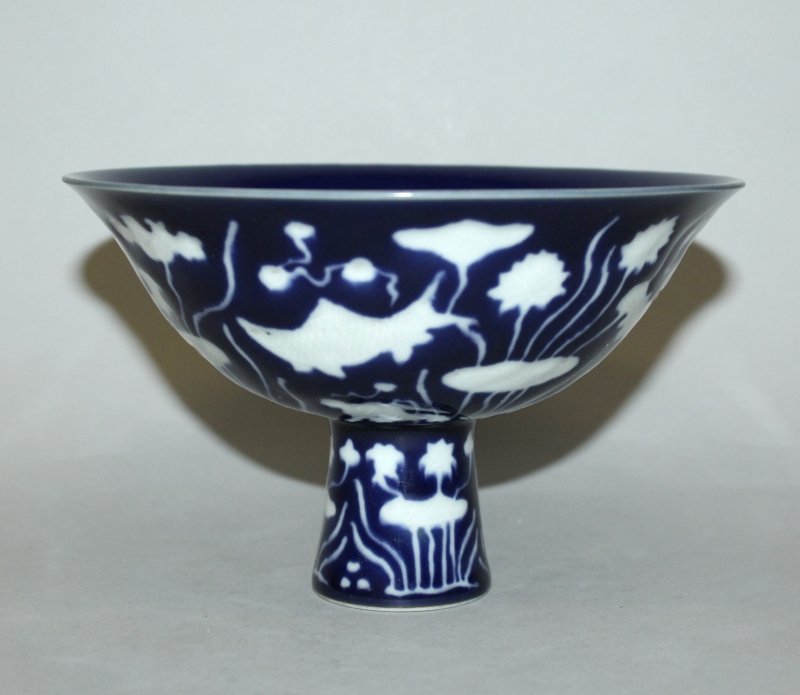 A CHINESE WHITE SLIP DECORATED BLUE GLAZED PORCELAIN (1 of 3)