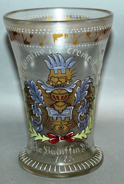 AN EARLY CONTINENTAL GLASS BEAKER-VASE, enamelled crest: AN EARLY CONTINENTAL GLASS BEAKER-VASE, enamelled crest Da Domine in Crementum 1625. 53/4ins high.