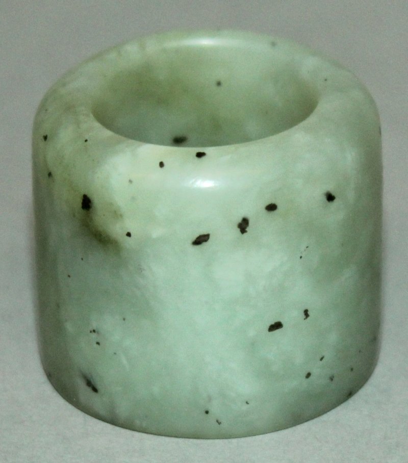 A CHINESE CELADON JADE-LIKE ARCHER’S RING, the stone (1 of 3)