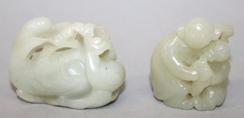 A SMALL CHINESE PIERCED CELADON JADE-LIKE MODEL OF A (1 of 4)