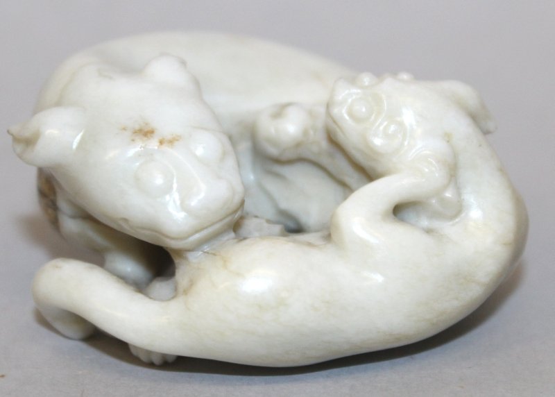 A SMALL CHINESE JADE-LIKE GROUP OF A CHILONG & ITS (1 of 6)
