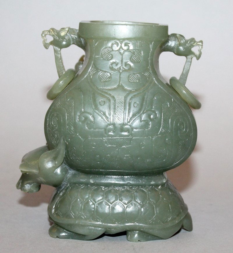 A CHINESE GREEN TURTLE-DRAGON JADE VASE, the mythical (1 of 3)