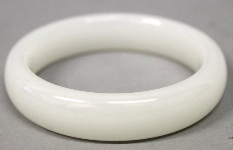 A CHINESE WHITE JADE-LIKE BANGLE, 3.1in diameter, the (1 of 1)