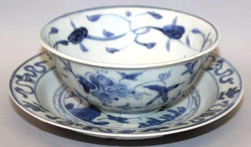 A 16TH CENTURY CHINESE MING DYNASTY PROVINCIAL BLUE &: A 16TH CENTURY CHINESE MING DYNASTY PROVINCIAL BLUE & WHITE PORCELAIN BOWL, painted with scrolling foliage, 5.75in diameter & 2.5in high; together with a 16th Century blue & white provincial Wanli pho