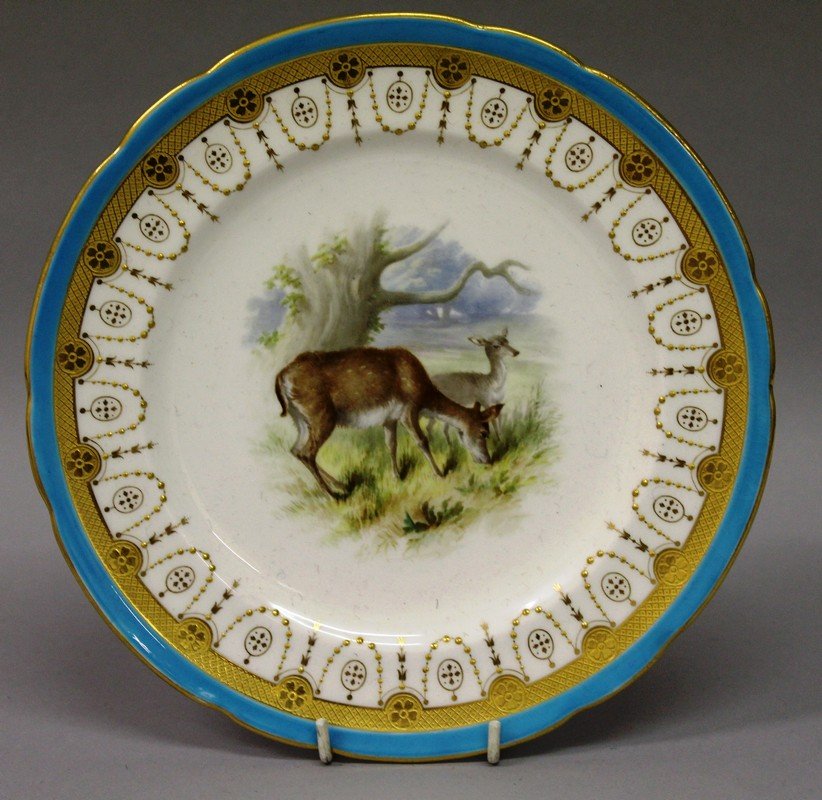 A 19TH CENTURY MINTON PLATE, painted with two deer: A 19TH CENTURY MINTON PLATE, painted with two deer beside a tree, in the style of Henry Mitchell. £40-60