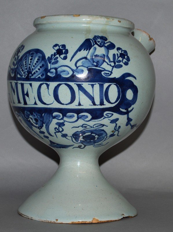 A DELFT BLUE AND WHITE TIN GLAZE DRUG JAR with spout,: A DELFT BLUE AND WHITE TIN GLAZE DRUG JAR with spout, S: DE MECONIO.7.5ins high. £200-400