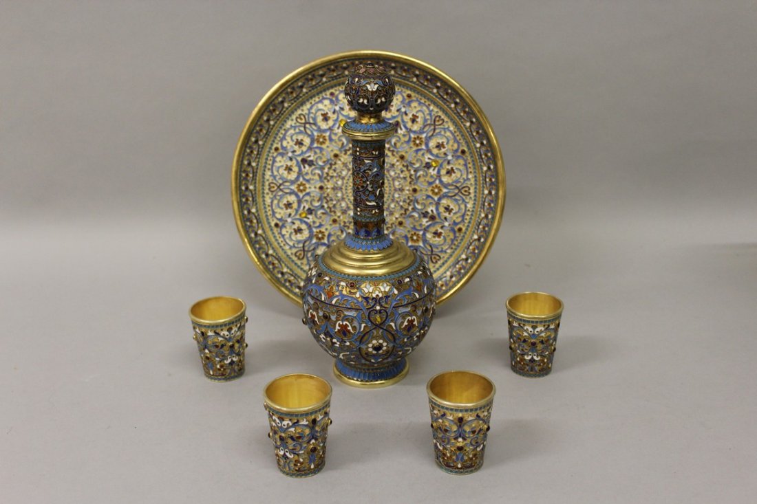 A SUPERB RUSSIAN SILVER AND ENAMEL DRINKS SET,: A SUPERB RUSSIAN SILVER AND ENAMEL DRINKS SET, comprising decanter and stopper, circular tray and four beakers. £2,000-3,000