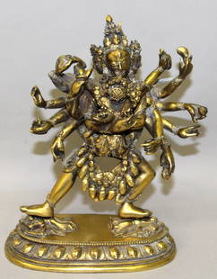 A GOOD QUALITY 18TH CENTURY SINO TIBETAN SECTIONAL GILT: A GOOD QUALITY 18TH CENTURY SINO TIBETAN SECTIONAL GILT BRONZE GROUP OF HAYAGRIVA & HIS CONSORT, supported on a lotus plinth, the multi-masked and multi-armed deity trampling figures underfoot, the de