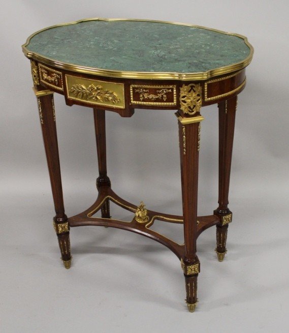 A GOOD LINKE DESIGN MARBLE, ORMOLU AND MAHOGANY CENTRE: A GOOD LINKE DESIGN MARBLE, ORMOLU AND MAHOGANY CENTRE TABLE, the shaped oval top supported on tapering square legs united by a pierced under-tier. 2ft 2ins long x 1ft 6ins wide x 2ft 7ins high.