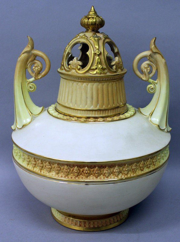 A LARGE ROYAL WORCESTER LIDDED CIRCULAR POT POURRI AND: A LARGE ROYAL WORCESTER LIDDED CIRCULAR POT POURRI AND COVER with two handles and pierced lid. Pattern No. 1256 12ins high, 9ins diameter.