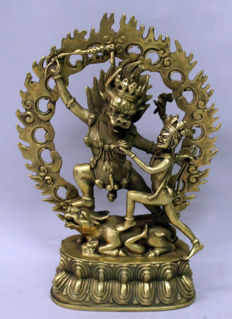 A TIBETAN GILT BRONZE GROUP OF YAMA & YAMI, on a double (1 of 8)