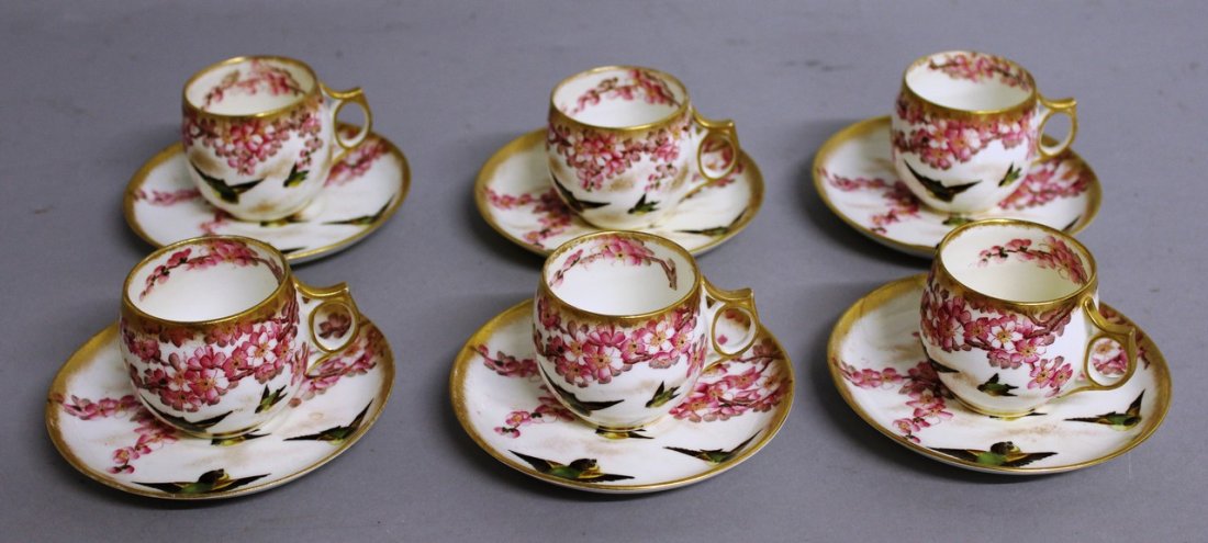 A SET OF SIX GEORGE JONES COFFEE CUPS AND SAUCERS,: A SET OF SIX GEORGE JONES COFFEE CUPS AND SAUCERS, birds and bloom pattern.
