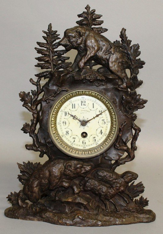 A 19TH CENTURY FRENCH "BLACK FOREST DESIGN" IRON MANTLE: A 19TH CENTURY FRENCH "BLACK FOREST DESIGN" IRON MANTLE CLOCK, D. BOUTRY, LILLE, the case with bears and sheep. 14ins high.