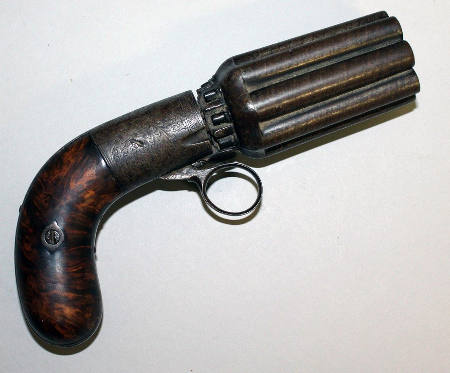 AN EIGHT-SHOT PEPPERBOX PERCUSSION CAP GUN, engraved: AN EIGHT-SHOT PEPPERBOX PERCUSSION CAP GUN, engraved with wooden handle. 7ins long.