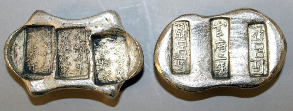 TWO CHINESE SILVER-METAL INGOTS, weighing approx. (1 of 4)