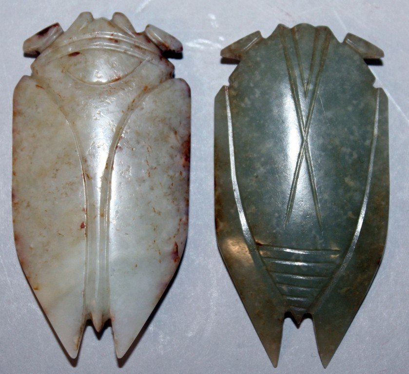 TWO SIMILAR CHINESE JADE CARVINGS OF CICADAS, one dark (1 of 4)